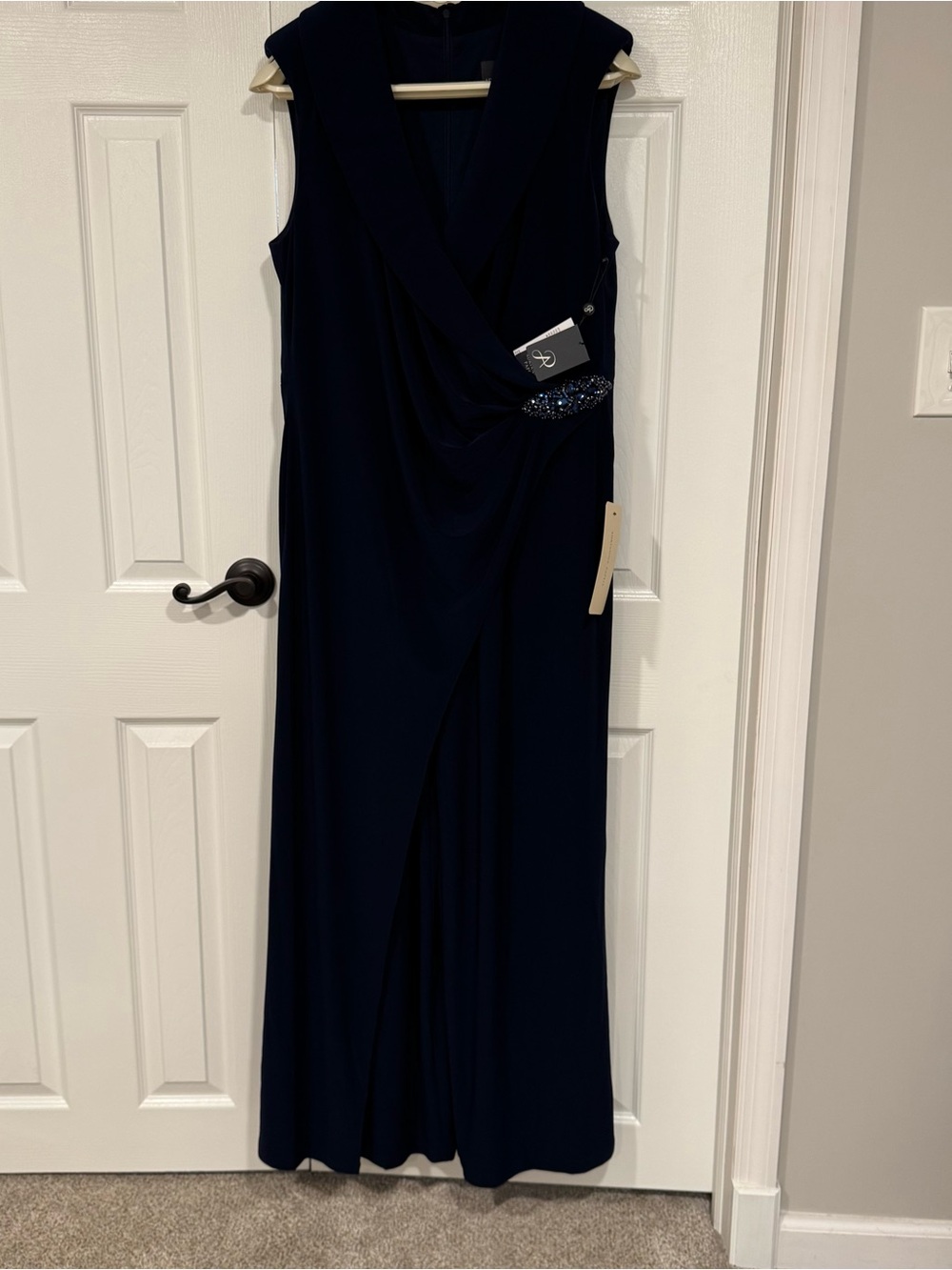 Adrianna Papell Navy Sleeveless formal jumpsuit with Beaded details at waist.